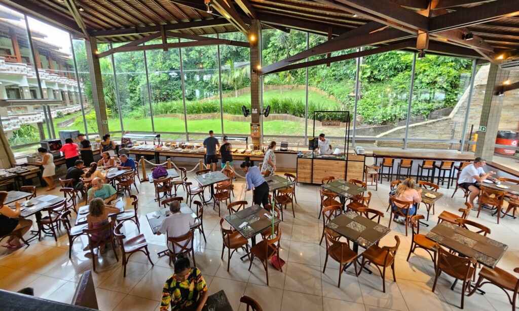 furniture, building, table, ceiling, cafeteria, floor, indoor, people, chair, large, food court, area, ground floor, restaurant