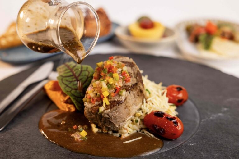 Main Entrée- Grilled filet mignon in a campagna sauce with shoestring potatoes, roasted carrot bastonetes and biro biro rice (1) united cardápio brasileiras